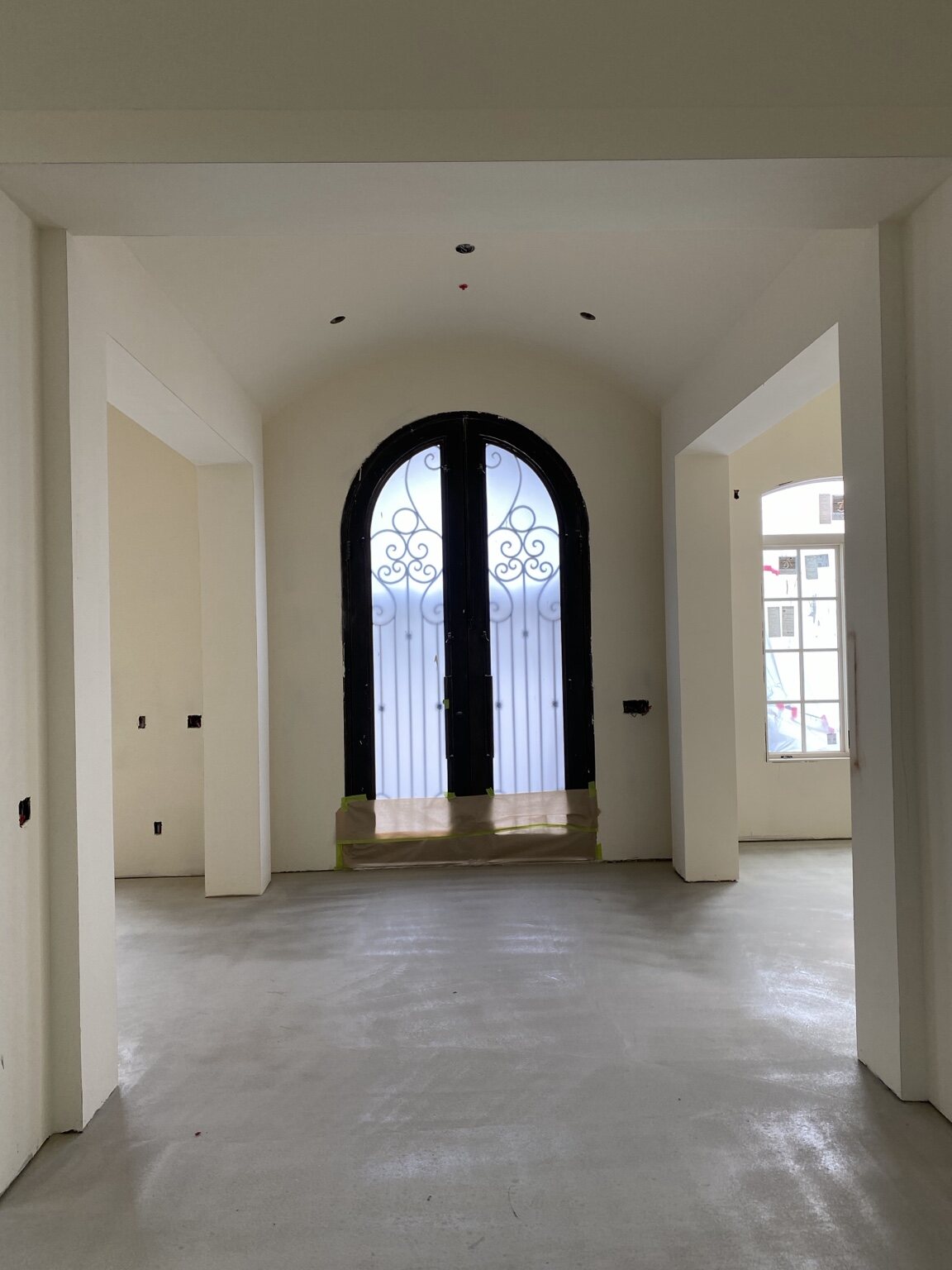 Arched entry doors and detailed interior openings