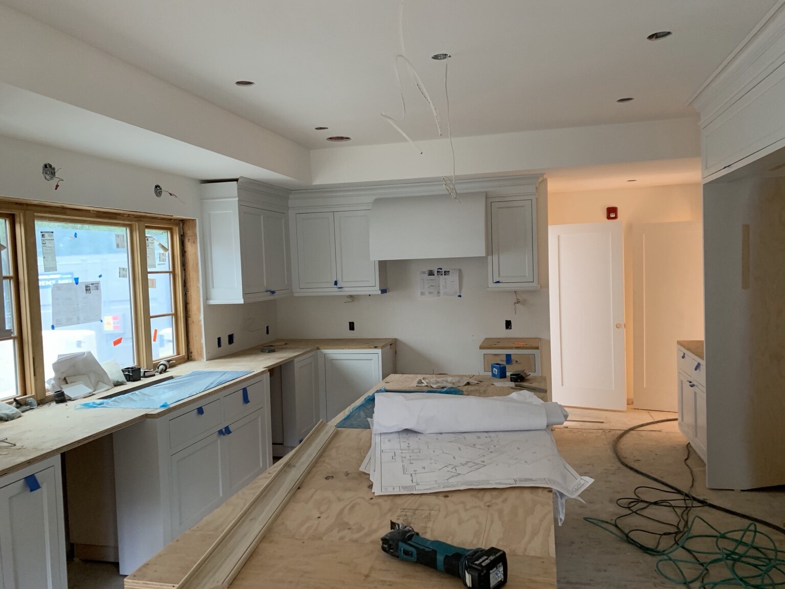 Traditional painted kitchen casework and cabinet installation