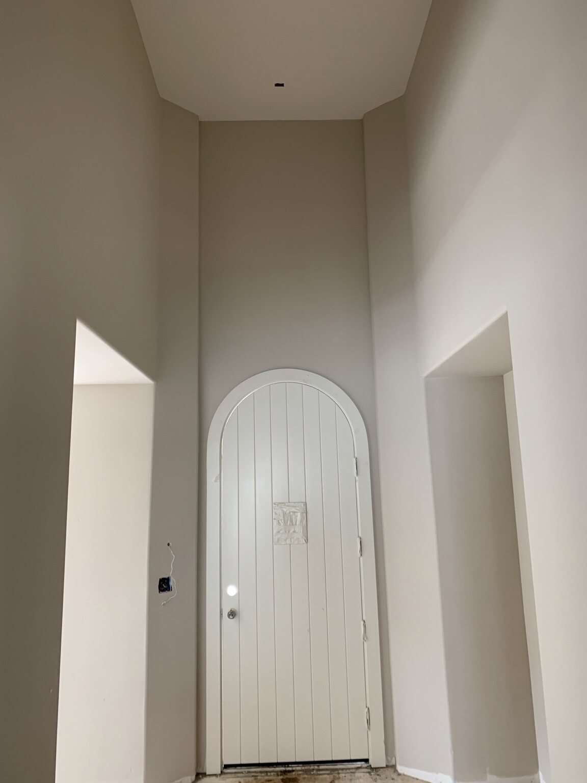 Custom arched interior door with fitted trim