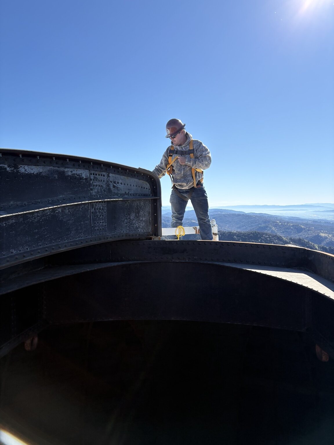 Noland Builders crew member working safely at height on the observatory structure