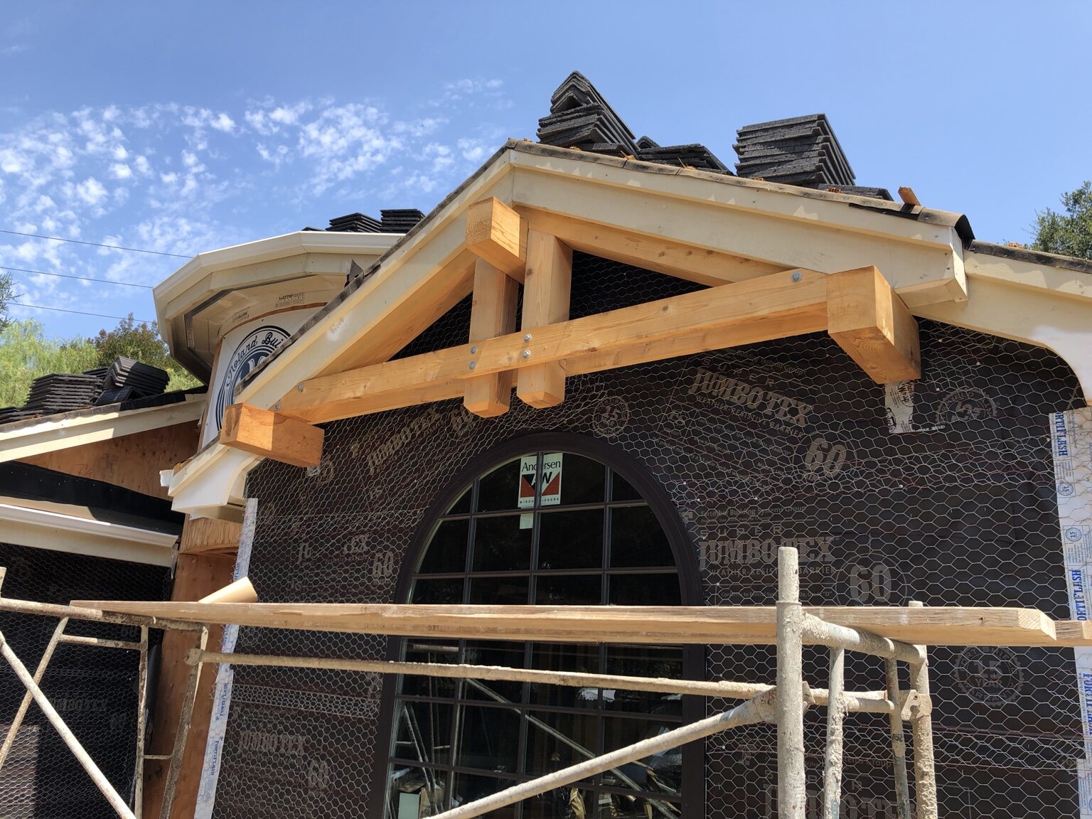 Custom gable framing and arched window detail