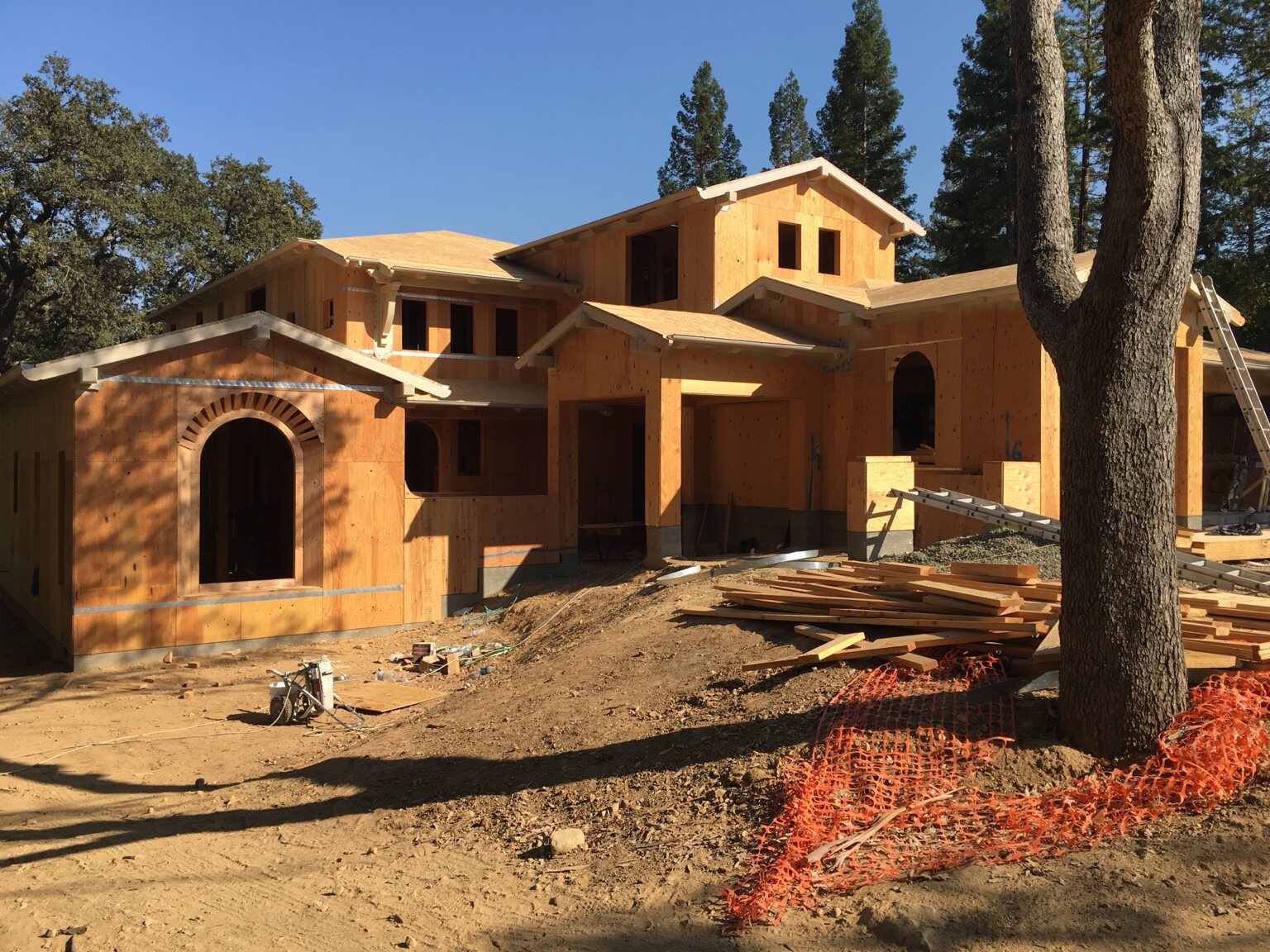 Front elevation framing and complex rooflines at the Monte Sereno home