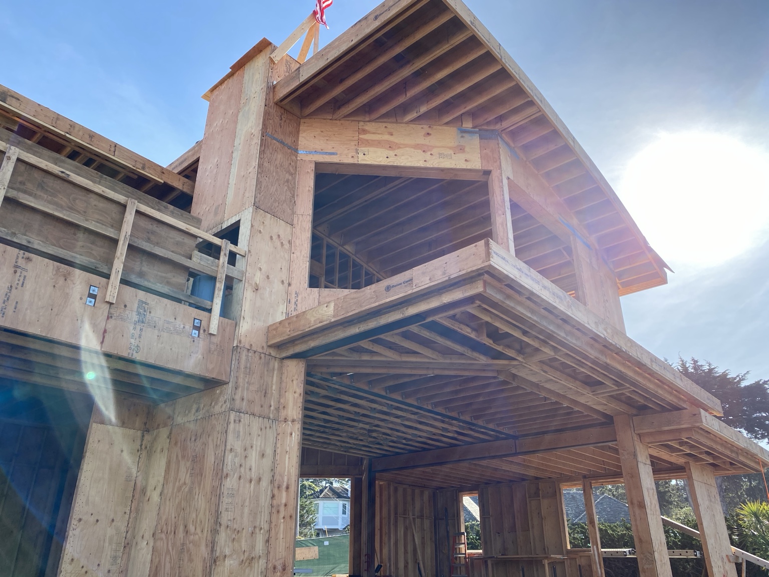 Framed balcony, deep overhangs, and structural detailing at the Pebble Beach residence